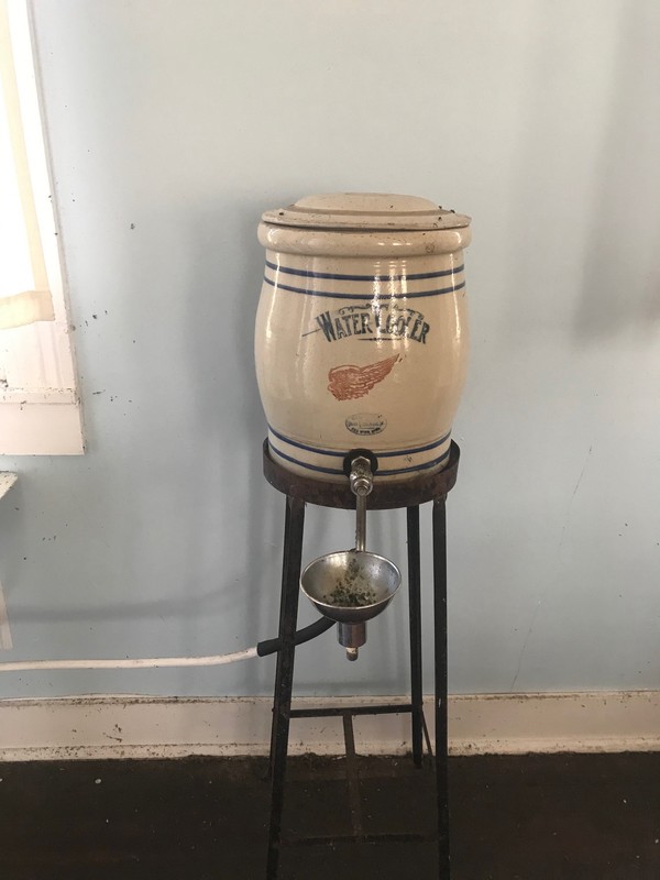 Water fountain inside schoolhouse