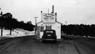 This image shows the entry gate to the historic Manhattan Project facilities in Los Alamos, New Mexico.