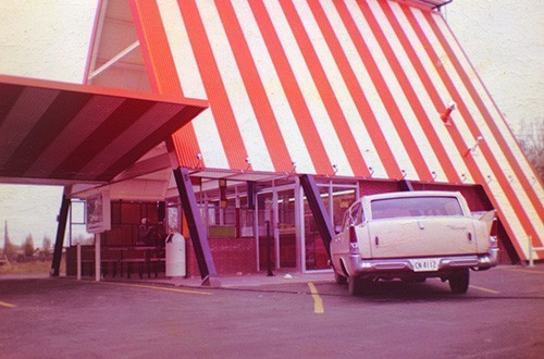 The first Whataburger ever with A-Frame architecture, and white and orange striped roof.