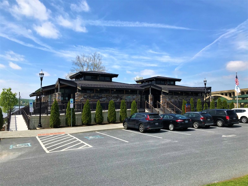 View of Columbia Crossing River Trails Center's front façade and parking lot