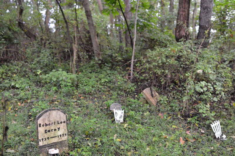 Many of the grave markers are in wooded areas like this one