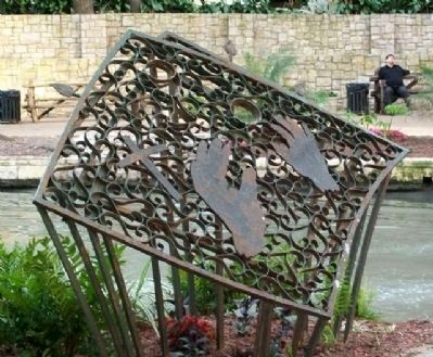 The sculpture depicts Padre Massanet's hands celebrating mass.