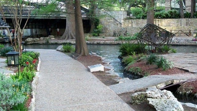 They are situated along the San Antonio River Walk.