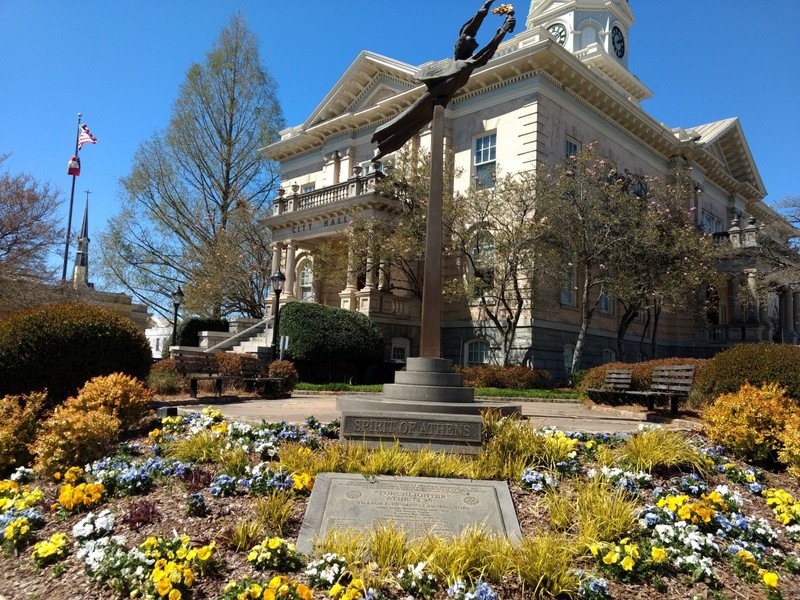 "Torchlighter" stands right outside of City Hall. The inscription on the base of the statue is  from Ephesians 4:3, which reads, "Endeavouring to keep the unity of the Spirit in the bond of peace." The statue was donated by the Athens Rotary Club.