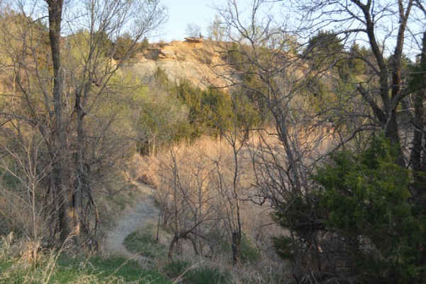 This is a view of the park from the west looking up at Indian Rock hill. There is a splendid view of Salina and the Smoky Hill River from the top of the hill. The small pond, which provided sand, gravel, and clay for brick making is in the foreground