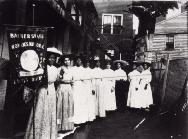 Nannie Helen Burroughs Holding a Woman's National Baptist Convention Banner, c. 1905-1915