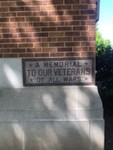 "A Memorial To Our Veterans Of ALL WARS"
Located on East side of front of the building.