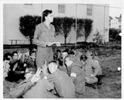 A picture of the soldiers during the sitdown protest. Walter Pawlowski stands to read their list of demands.