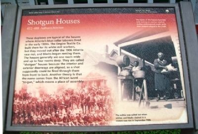 Photograph of the Shotgun Houses Historical Marker.