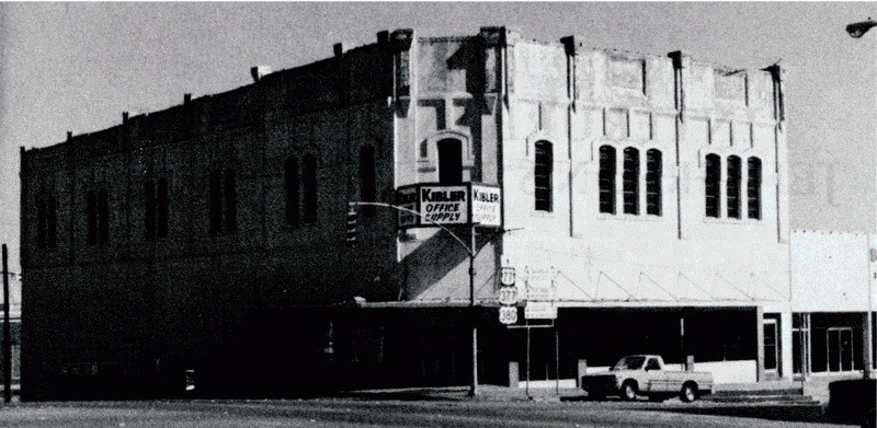 Front view of the Wright Opera House in 1982. The Kibbler Office Supply Store's sign visible on the front. During this time the opera house was vacant.