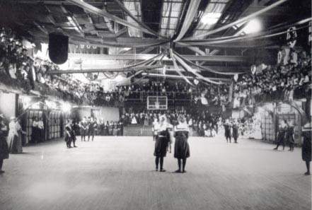 This is the Alumnae Gymnasium hosting a women's basketball game in 1901.
http://print.positronicdesign.com/portfolio/portfolio-print-postcards-smith-college-athletics/