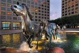 Another view of The Mustangs of Las Colinas where you can see them galloping through the water. Date unknown.