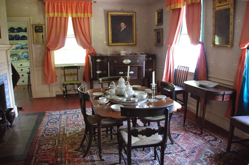 The house's first floor dining room has been restored to its early 19th century appearance. 