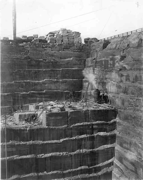 This picture represents how large the quarries are. The ladder had to be used for the workers to be able to get to and from their work stations in 1921. 