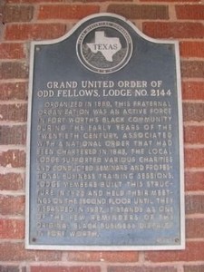 The marker is affixed to the east wall of the building along Grove Street.