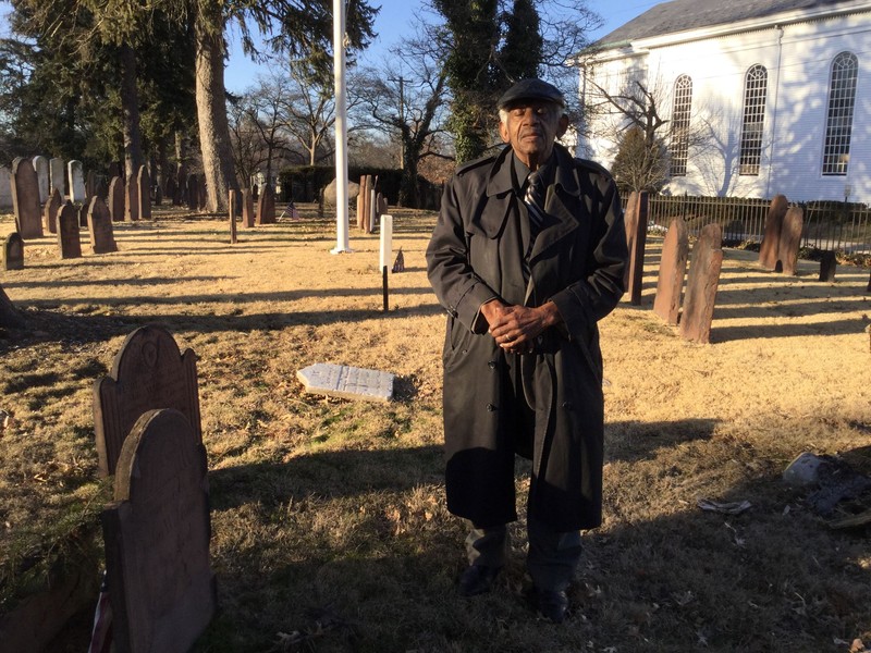 L. Wallace Brown visiting the site he remembers as his grandmother's grave.