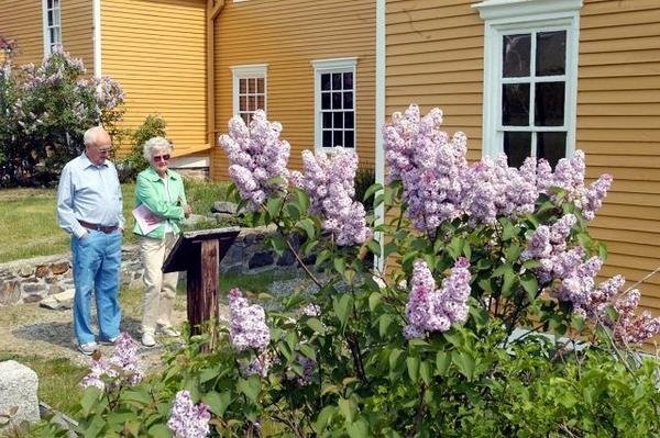 These visitors enjoy the mansion's annual Lilac Festival which occurs in late May. 