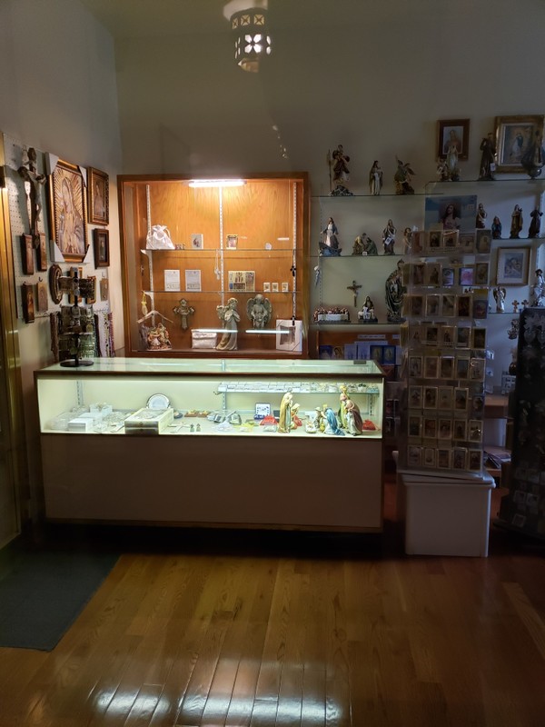 A shop inside of the church selling various devotions and other religious merchandise. This has proven to be a major source of revenue for the church's operations.