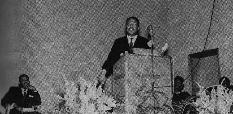 Dr. King speaking at Oakwood College during his visit to Huntsville. Seated on the left is Ralph David Abernathy