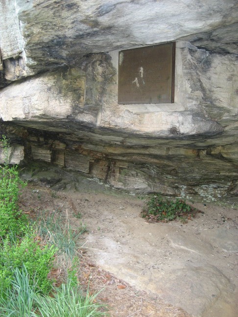 A metal plaque on Shelving Rock reads: "First Night's Encampment of Kings Mountain Men, September 26, 1780. They trusted in God and kept their powder dry. Placed by John Sevier Chapter, DAR, 1910, Reset 1965.