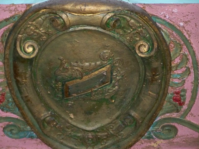 Close-up of one of the plaster medallions on the proscenium arch