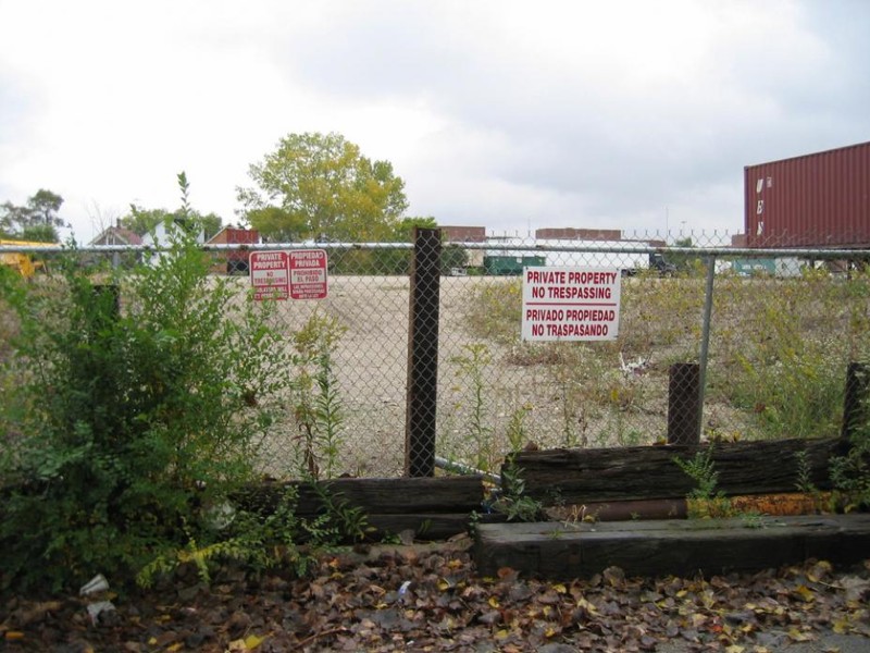 This image shows the state of the Celotex site prior to cleanup. Plastered with private property signs, the chain link fence kept out the community and its public interests. Its reclamation created a space taken by the community for the community.