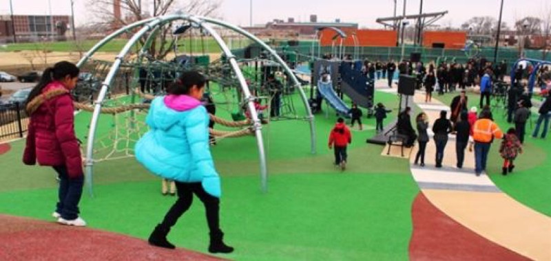 This photo taken on opening day shows that the park forms relationships between children, parents, and whole families. The park provides the opportunity for community building as if giving back to the community that created it.