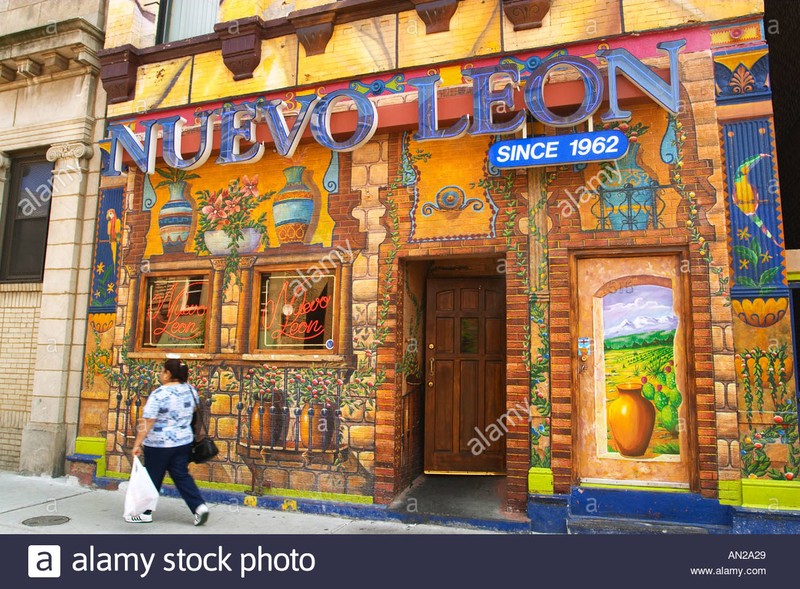 “Street Scene Chicago Illinois Pilsen ethnic Hispanic neighborhood Nuevo Leon restaurant mural on building” by Kim Karpeles/Alamy Stock Photo. 17 x 11.3 inches. 27 May 2003. Retrieved May 28th, 2019. 