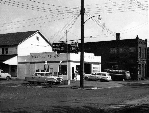 fNorthwest corner of Prospect & Mechanic in the 1950s, showing the feed mill on the left, Tanner's Cheese House on right, McKandy's Oil.