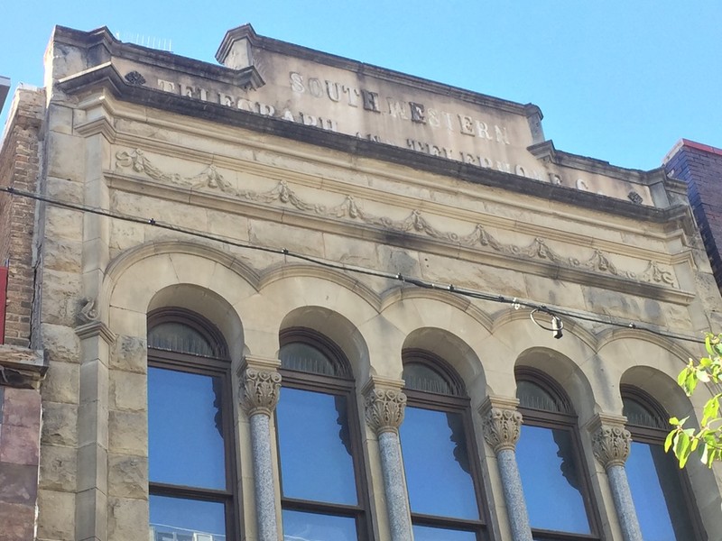 The Southwest Telegraph and Telephone Company Building name can still be seen on the top of the historical building. 