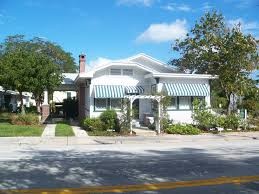 Volunteers guide guests through the exhibits and gardens of the Cason Cottage Museum which is located in an historic South Florida home