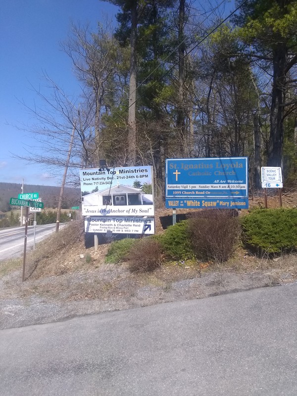 Intersection of Church Road and Buchanan Valley Road with sign indicating Mary Jemison, "White Squaw"