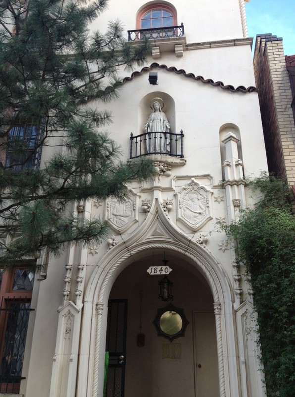 Front door of Seton House with Mother Mary looking over visitors