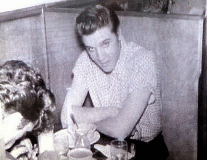 The photo of Elvis sitting in the famous Elvis Booth, taken by Paul Cramer in 1956