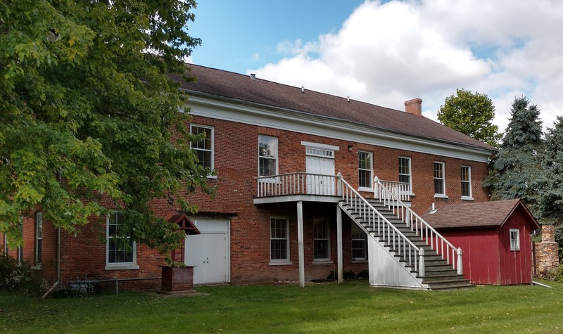 These back stairs have an unusual angle and wide bearing because they were originally used to role wagons down from Wagon Hall where the buggies were put together. Originally there was an earthen ramp with stairs being built later. These have recently been refurbished. 