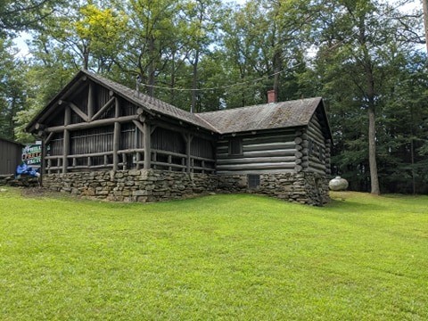 Overlook Trading Post from the rear. Note the different construction style of the original cabin and the original picnic enclosure surrounding the newer solid walls of the front section