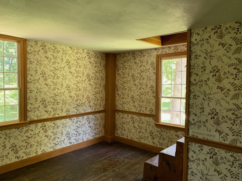 One of the upstair bedrooms, and the stairs that lead up to the attic.