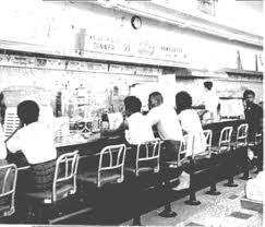The St. Augustine Four sitting at the counter of Woolworth's. The site is on the National Register of Historic Places.