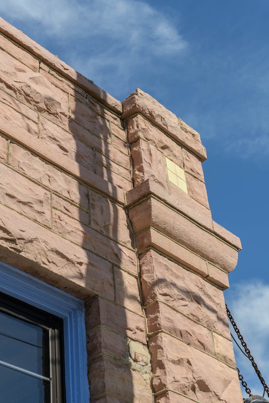 One of the corbels on the corner of the Turner-Stevens Building. 
Photo courtesy of Eric Hoyt. 