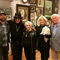 Ozzy Osbourne and his children with Leila in her hair museum.