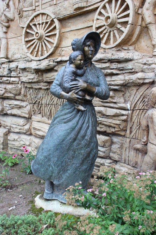 Compare this 2006 Charles Goslin pioneer woman in Shawnee, KS, to the one he sculpted for Independence, MO. Photo by Cynthia Prescott.