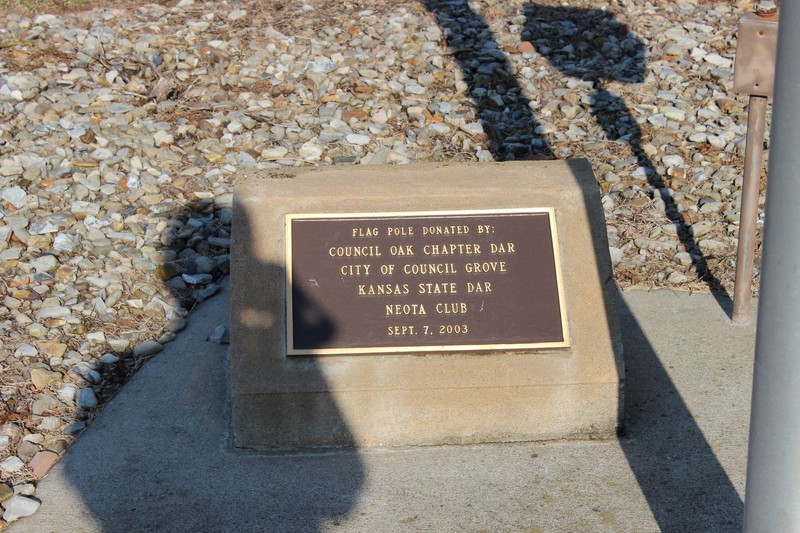 Flag pole plaque. Photo by Cynthia Prescott.