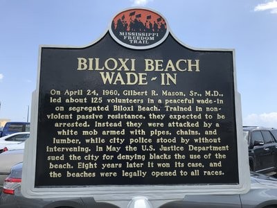 The marker was dedicated in 2009 and is in the parking lot by the beach.
