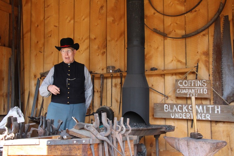 One of Four Mile's docents and Blacksmiths explains the process to visitors