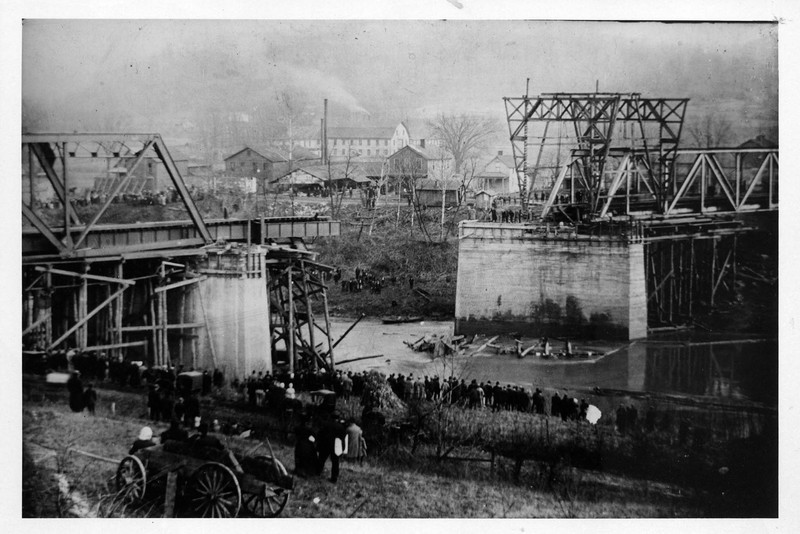 The middle span of the bridge collapsed under the weight of the train, apparently because of the temporary supports in place at the time. Image courtesy of Marshall University Special Collections. 