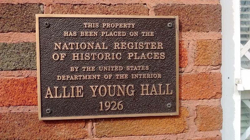 Allie Young Hall, which has since taken the place of the Normal School, with its plaque commemorating its recognition from The National Register of Historic Places.