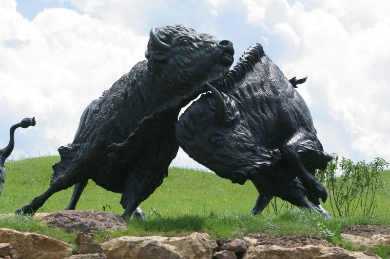 Two bison of the Lakota Bison Jump sculpture created by artist Peggy Detmers.