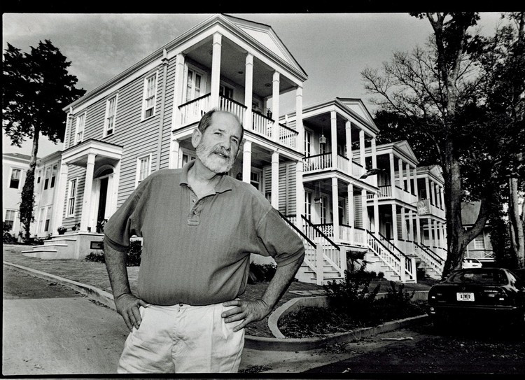 Owner Dan Camp standing in front of some of the houses in the Cotton District