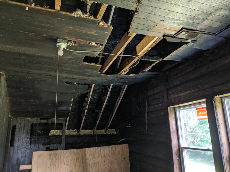 The upstairs right bedroom. The aftermath of the fire is readily apparent