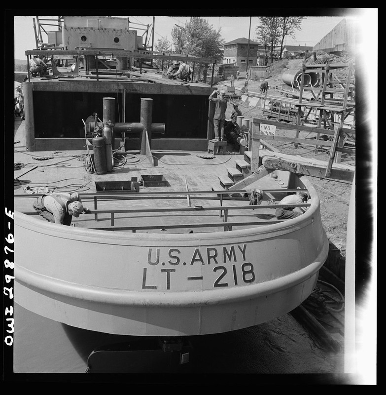 Workmen clamber over a U.S. Army boat (LT stands for "large tug") under construction at Marietta in 1943. Launched in August of that year, LT-218 was later sold to China in 1947.